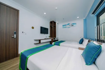 Chambre Deluxe Queen avec deux lits queen — TOMMY HOTEL